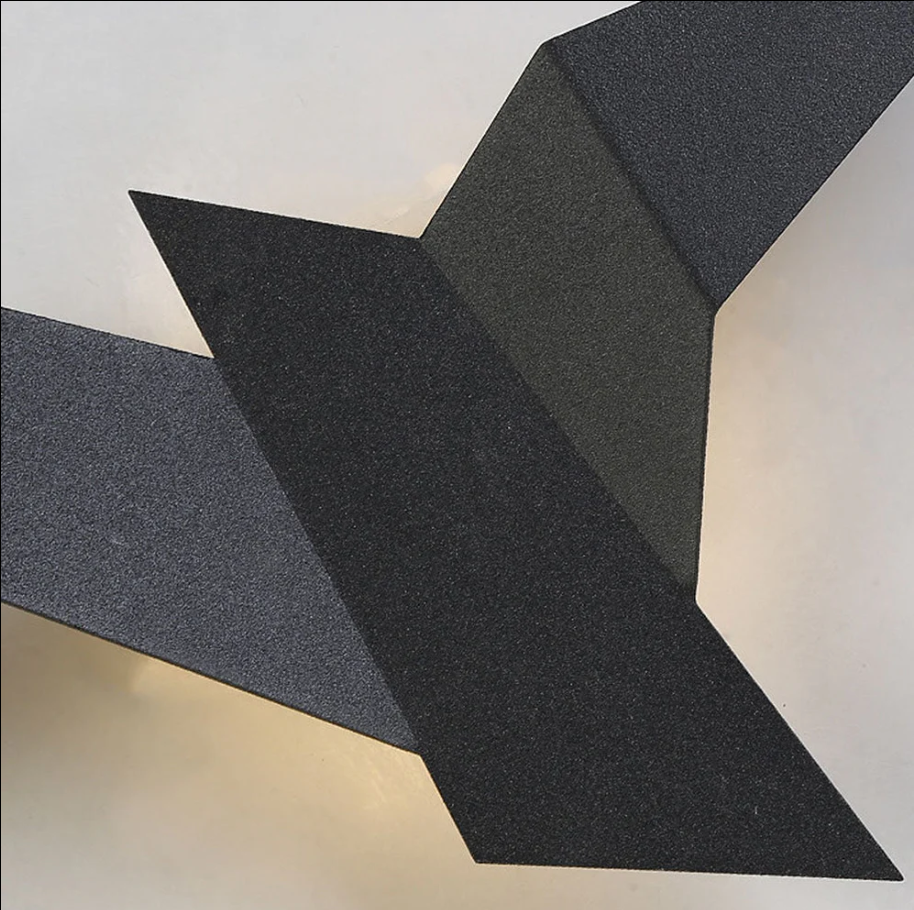 Kreative wandleuchte aus eisen in vogelform